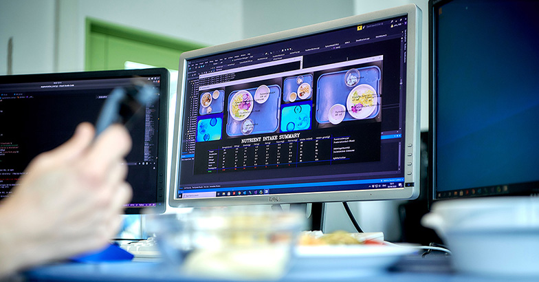 Computer screen with machine learning estimating nutrients in food images (ARTORG Center, University of Bern)